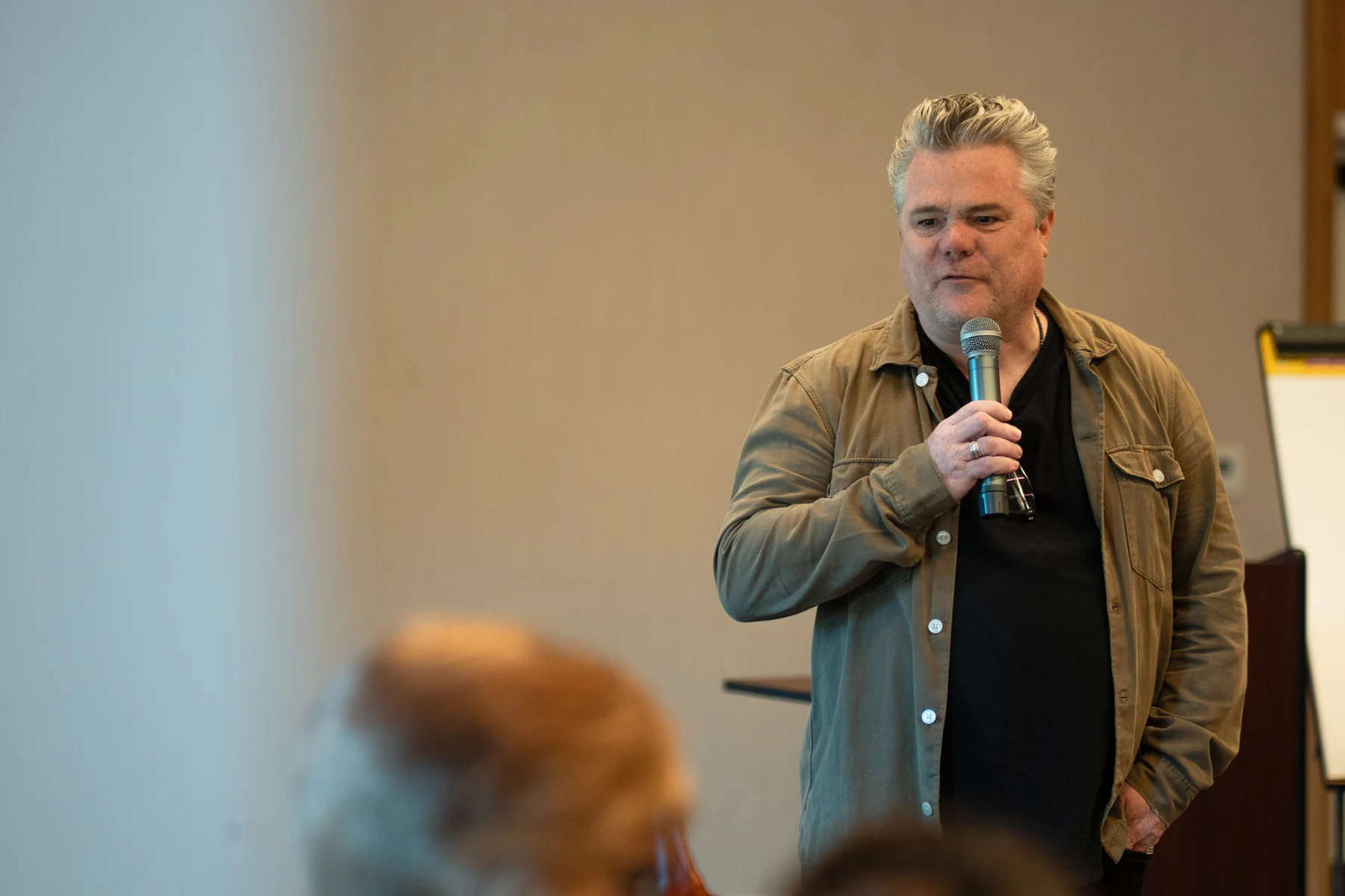 Speaking to the room.
